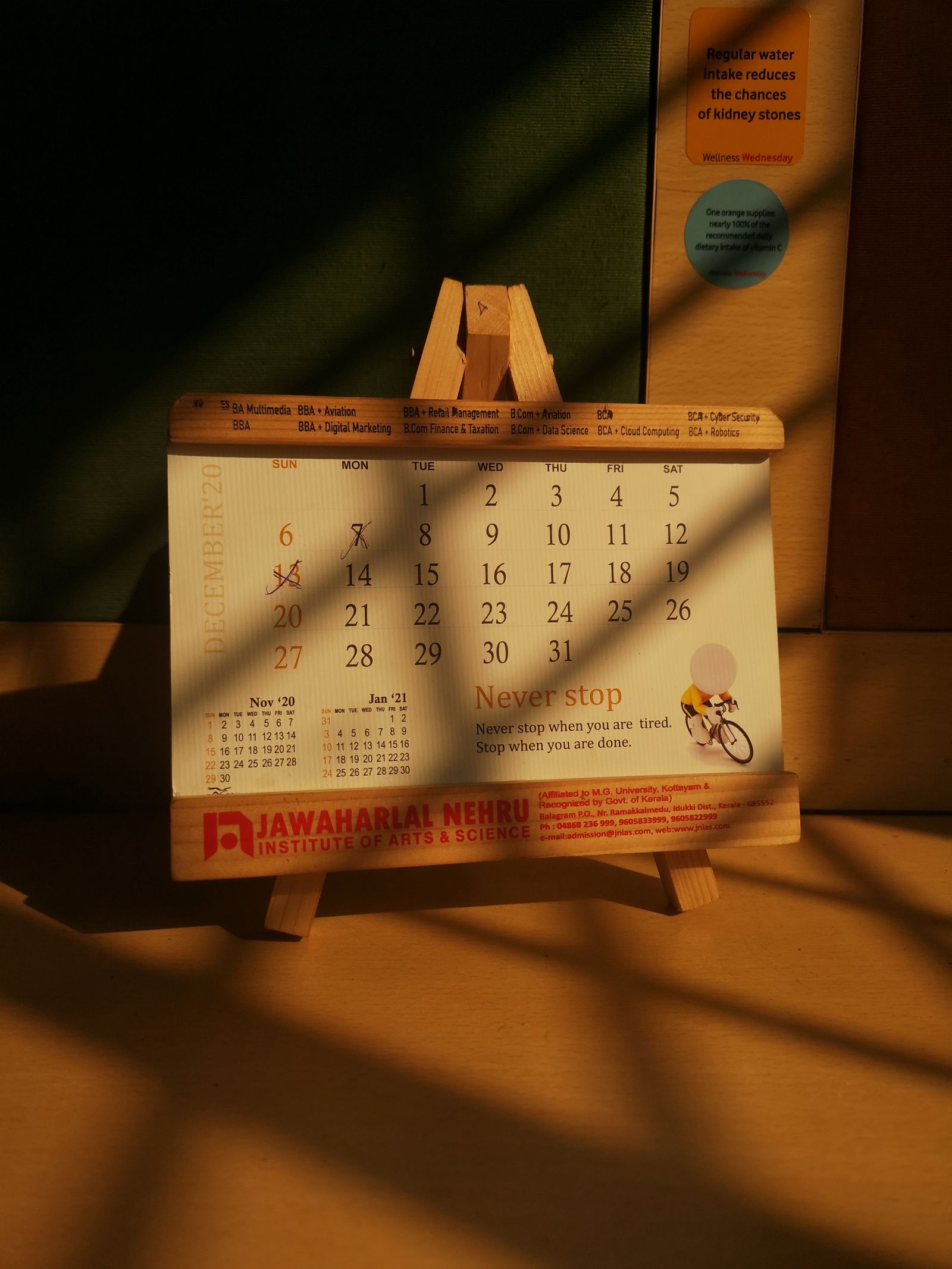 A wall calendar with a date circled in red